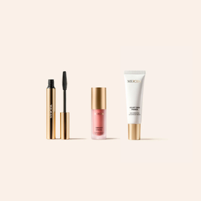 Meroda Minis Set mit Gilded Lashes Mascara, Vibrant Cheeks Liquid Blush und Velvet Skin Primer in Gold-Optik.