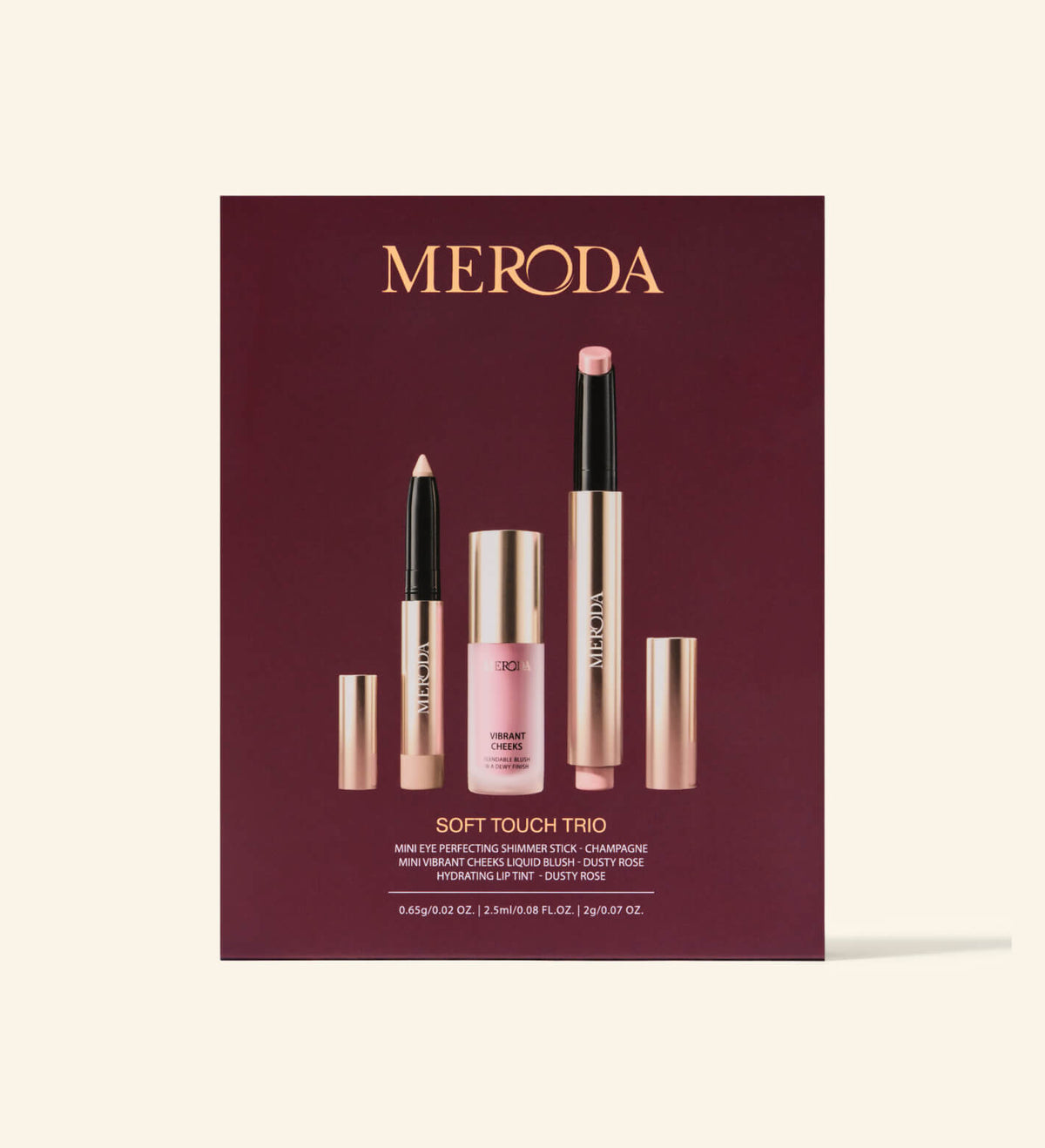 Soft Touch Trio Make-up-Set mit Eye Shimmer Stick, Liquid Blush und Lip Tint vor burgunderrotem Hintergrund.